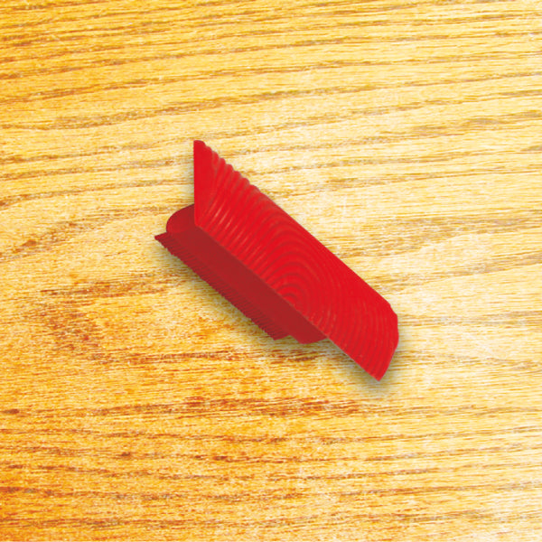 Tamponcino in gomma utilizzato per riprodurre le venature tipiche del legno.